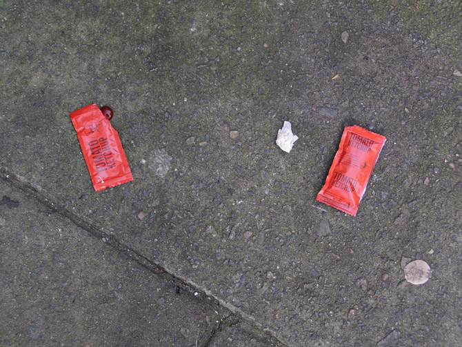 Sachets of KFC tomato sauce - oddly one front and one back.